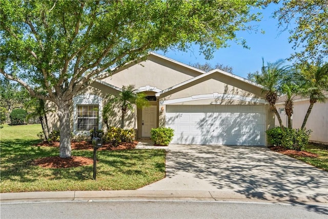 view of front of property featuring stucco siding, an attached garage, concrete driveway, and a front yard