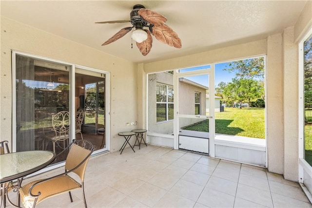 sunroom with a ceiling fan