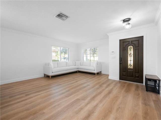 entrance foyer with crown molding and light hardwood / wood-style floors