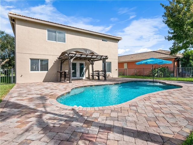 view of pool with a patio area and a pergola