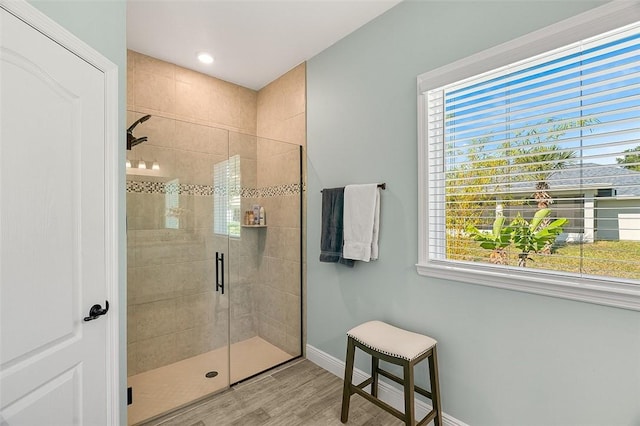 8645 95th Ave, Vero Beach, FL 32967 - bathroom featuring a stall shower, wood finished floors, baseboards, plenty of natural light, and recessed lighting