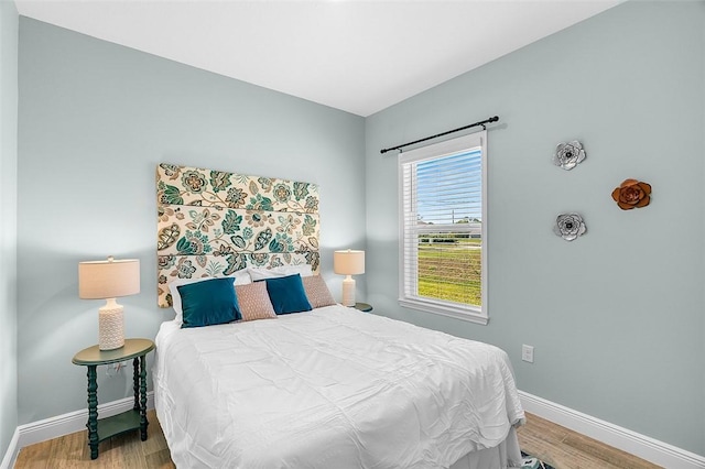 8645 95th Ave, Vero Beach, FL 32967 - bedroom featuring baseboards and wood finished floors