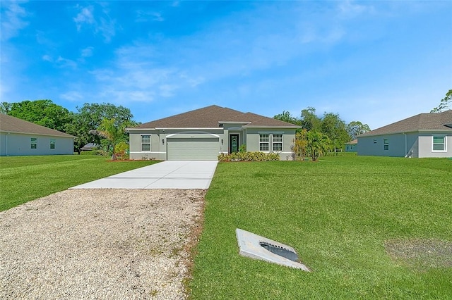 8645 95th Ave, Vero Beach, FL 32967 - single story home with concrete driveway, an attached garage, a front yard, and stucco siding
