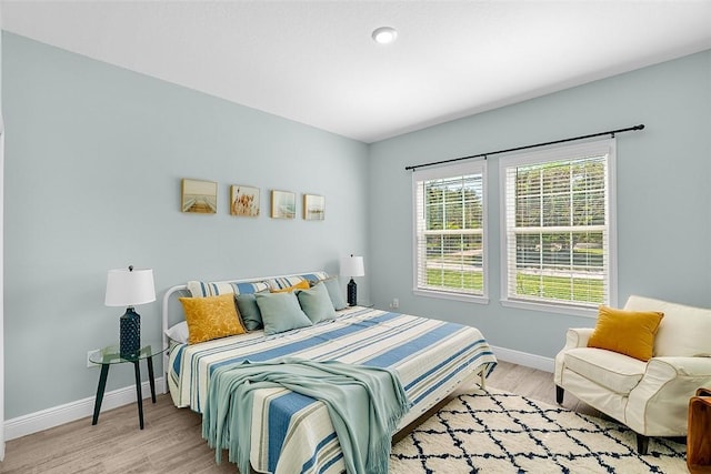 8645 95th Ave, Vero Beach, FL 32967 - bedroom featuring baseboards and light wood-style floors