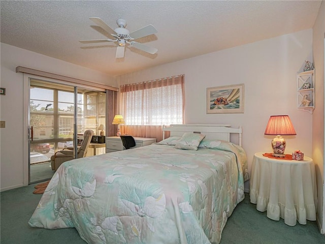 carpeted bedroom with ceiling fan, access to exterior, and a textured ceiling