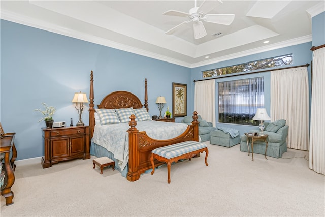 bedroom with light colored carpet, a raised ceiling, ceiling fan, and crown molding