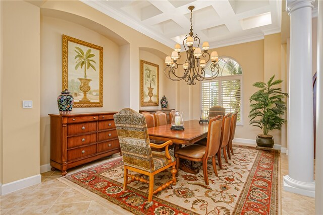 dining room featuring decorative columns, an inviting chandelier, and ornamental molding