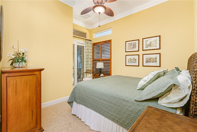 carpeted bedroom with ceiling fan and ornamental molding