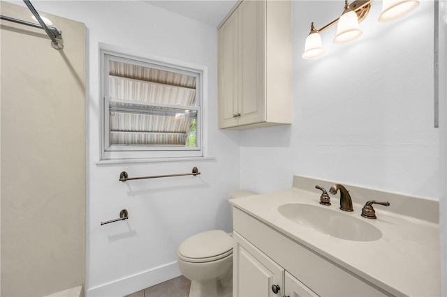 505 19th St, Vero Beach, FL 32960 - bathroom with toilet, vanity, tile patterned floors, and baseboards