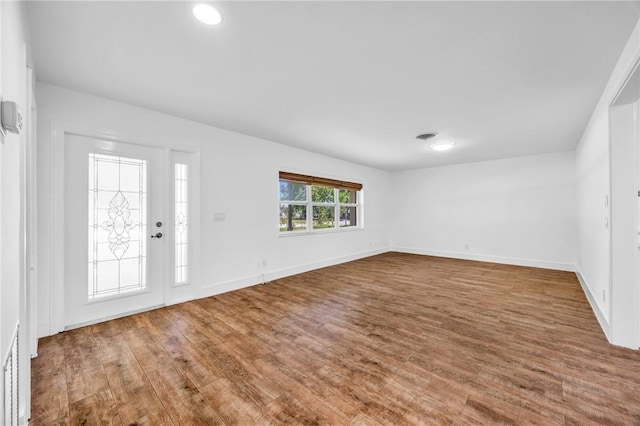 505 19th St, Vero Beach, FL 32960 - entryway with baseboards, visible vents, and wood finished floors