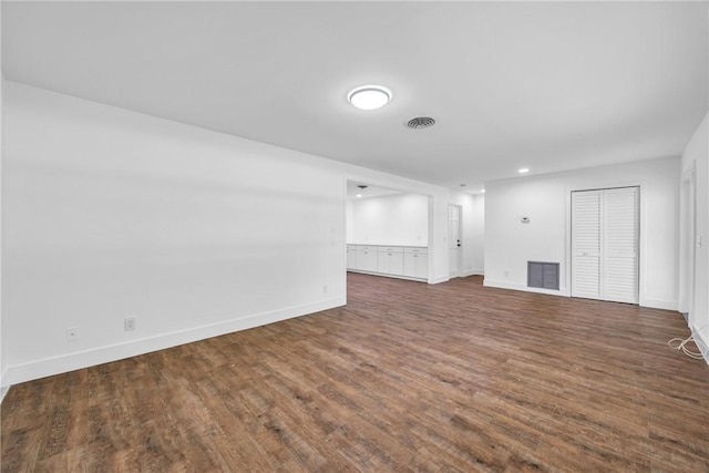 505 19th St, Vero Beach, FL 32960 - unfurnished living room with baseboards, visible vents, and dark wood-type flooring