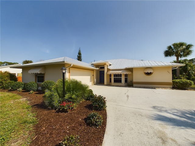 ranch-style house featuring a garage