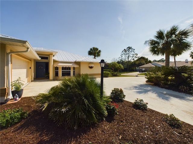 view of side of home featuring a garage