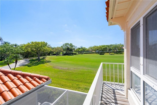 view of yard with a balcony