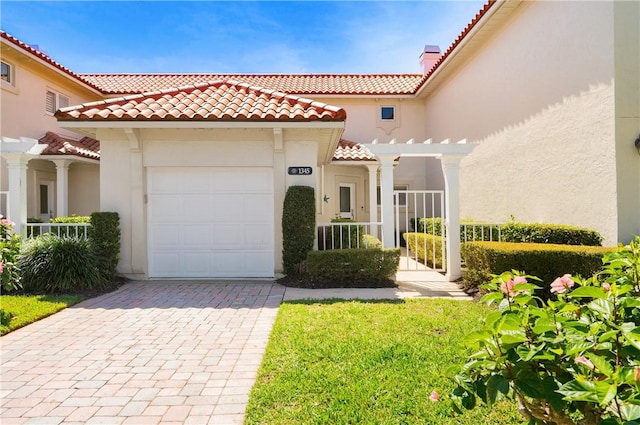 mediterranean / spanish-style house featuring a garage