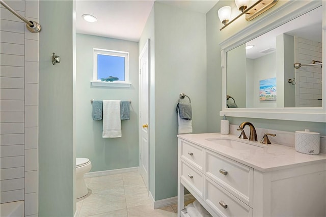 bathroom featuring vanity, walk in shower, and toilet