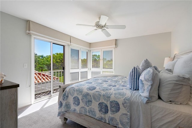 carpeted bedroom with access to exterior and ceiling fan