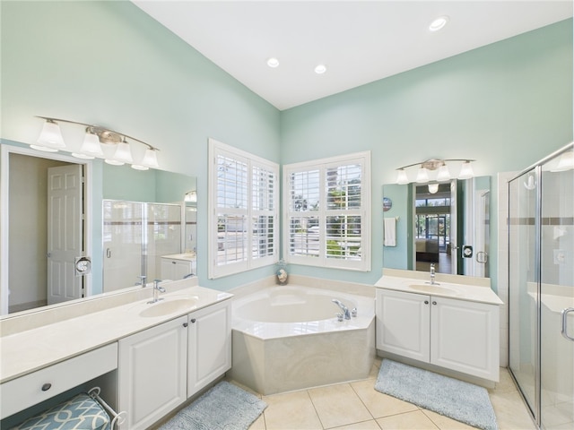 full bathroom featuring a bath, a shower stall, and a sink