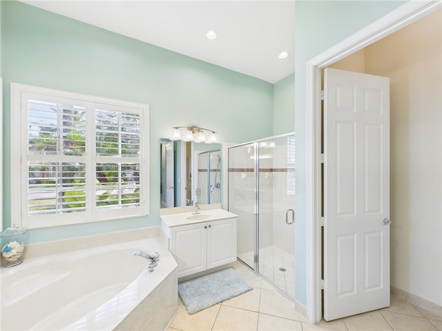 bathroom featuring a garden tub, recessed lighting, a stall shower, tile patterned floors, and vanity