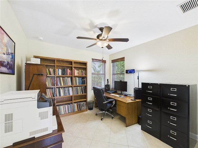 office area featuring light tile patterned floors, visible vents, and a ceiling fan