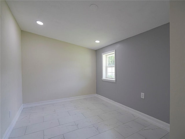 339 6th Ave SW, Vero Beach, FL 32962 - unfurnished room with light marble finish flooring and recessed lighting