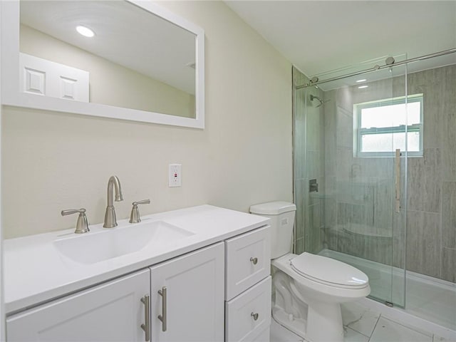 339 6th Ave SW, Vero Beach, FL 32962 - bathroom featuring a stall shower, vanity, and marble look tile flooring