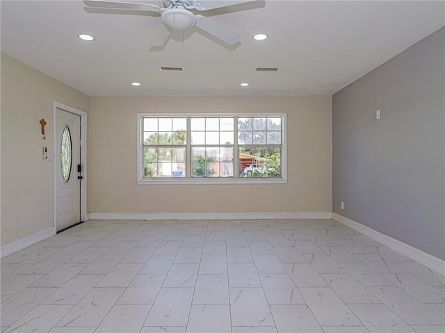 339 6th Ave SW, Vero Beach, FL 32962 - unfurnished room featuring light marble finish floors, recessed lighting, and ceiling fan