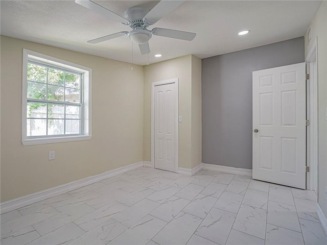 339 6th Ave SW, Vero Beach, FL 32962 - unfurnished bedroom featuring light marble finish flooring, recessed lighting, and ceiling fan
