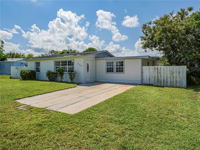 back of house featuring a yard