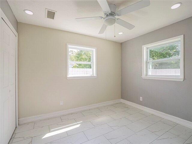 empty room featuring ceiling fan