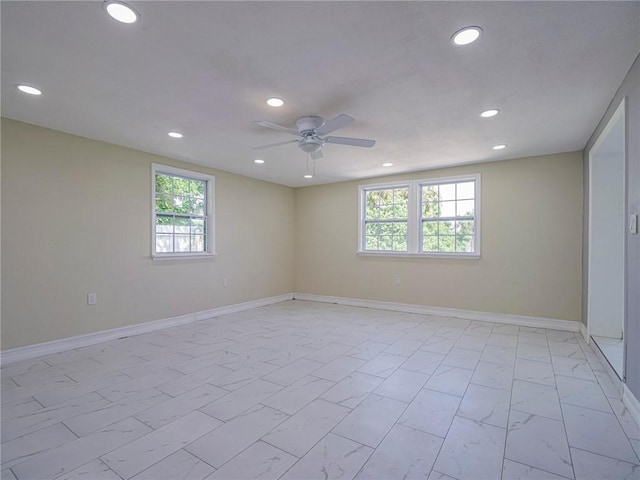 339 6th Ave SW, Vero Beach, FL 32962 - unfurnished room with light marble finish flooring, ceiling fan, plenty of natural light, and recessed lighting