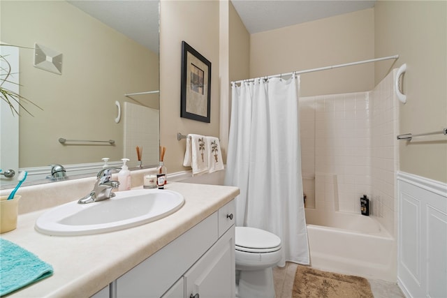 full bathroom with shower / tub combo, tile patterned floors, vanity, a textured ceiling, and toilet