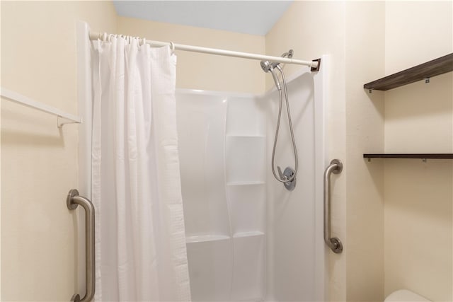 bathroom with a shower with shower curtain