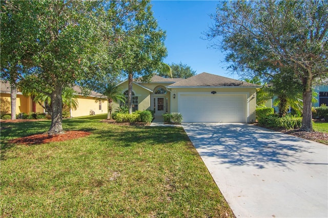 view of front of property with a garage and a front yard