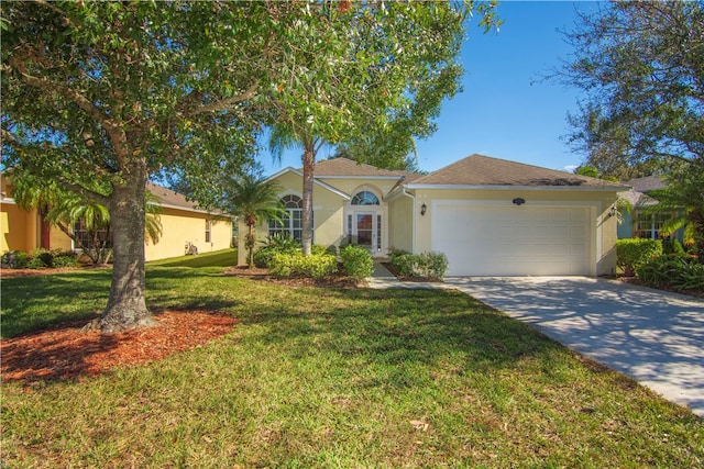 view of front of home featuring a front lawn and a garage