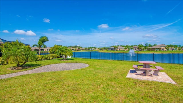 view of yard with a patio and a water view