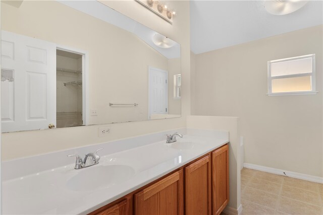 bathroom with tile patterned floors and vanity