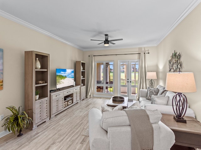 living room with french doors, light hardwood / wood-style flooring, ceiling fan, and crown molding