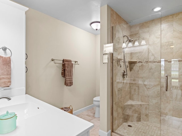 bathroom featuring a shower with door, tile patterned floors, toilet, and sink