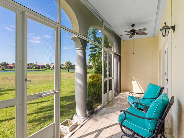 sunroom featuring plenty of natural light and ceiling fan