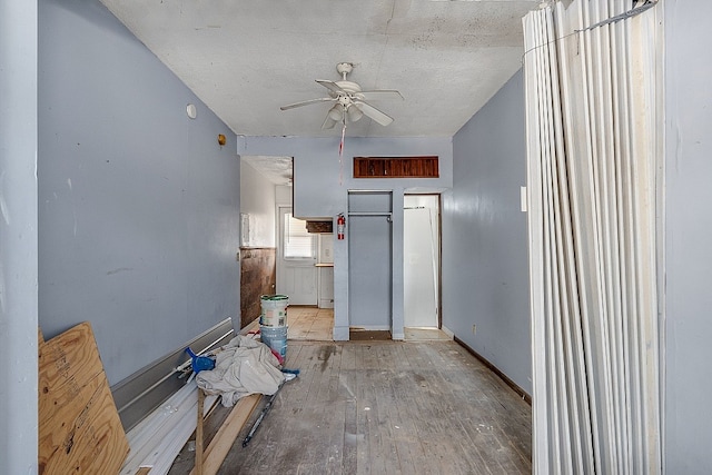 interior space with light hardwood / wood-style floors and ceiling fan