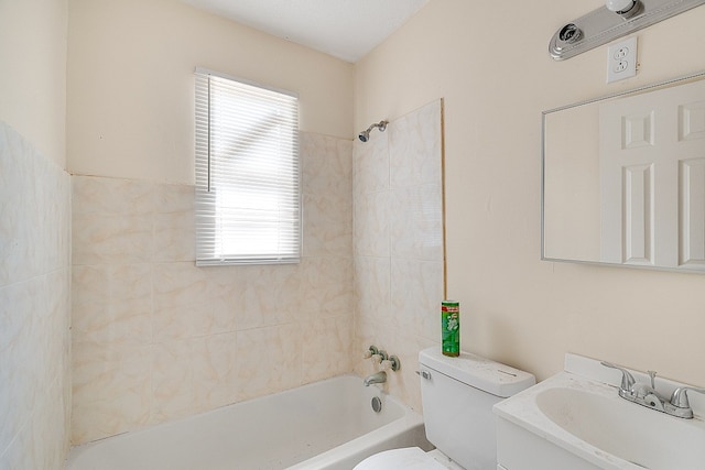 full bathroom featuring vanity, toilet, and tiled shower / bath combo