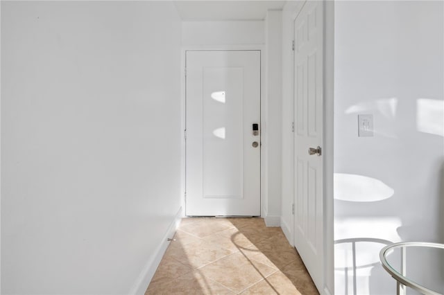 doorway to outside featuring light tile patterned floors