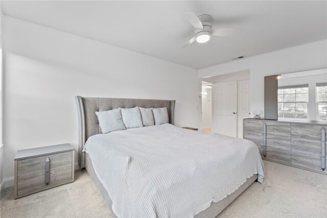 carpeted bedroom with ceiling fan