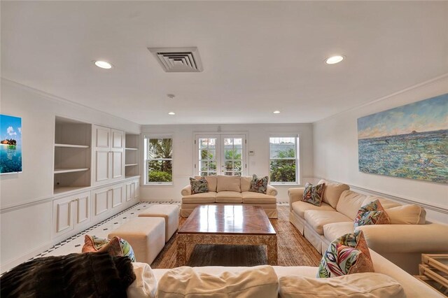 living room featuring built in shelves