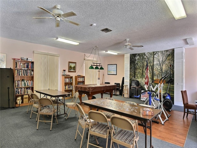 dining area with a textured ceiling, billiards, hardwood / wood-style flooring, and ceiling fan