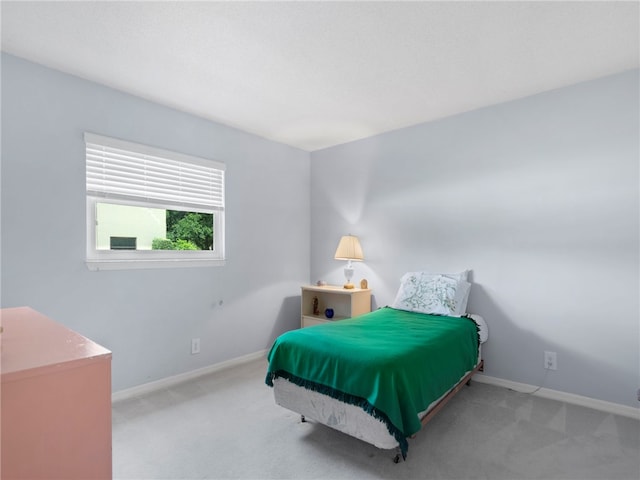 bedroom with light carpet