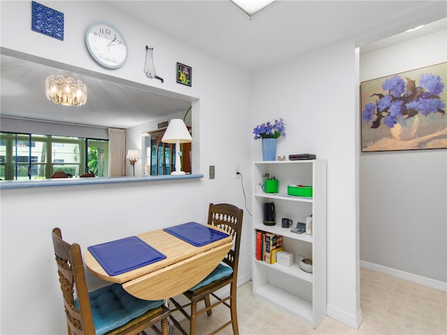 dining space featuring an inviting chandelier