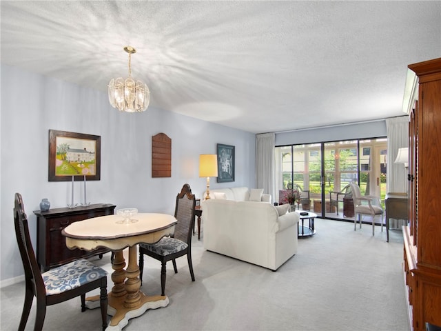 living room featuring a textured ceiling and light colored carpet