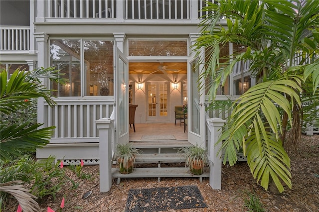 view of exterior entry featuring french doors